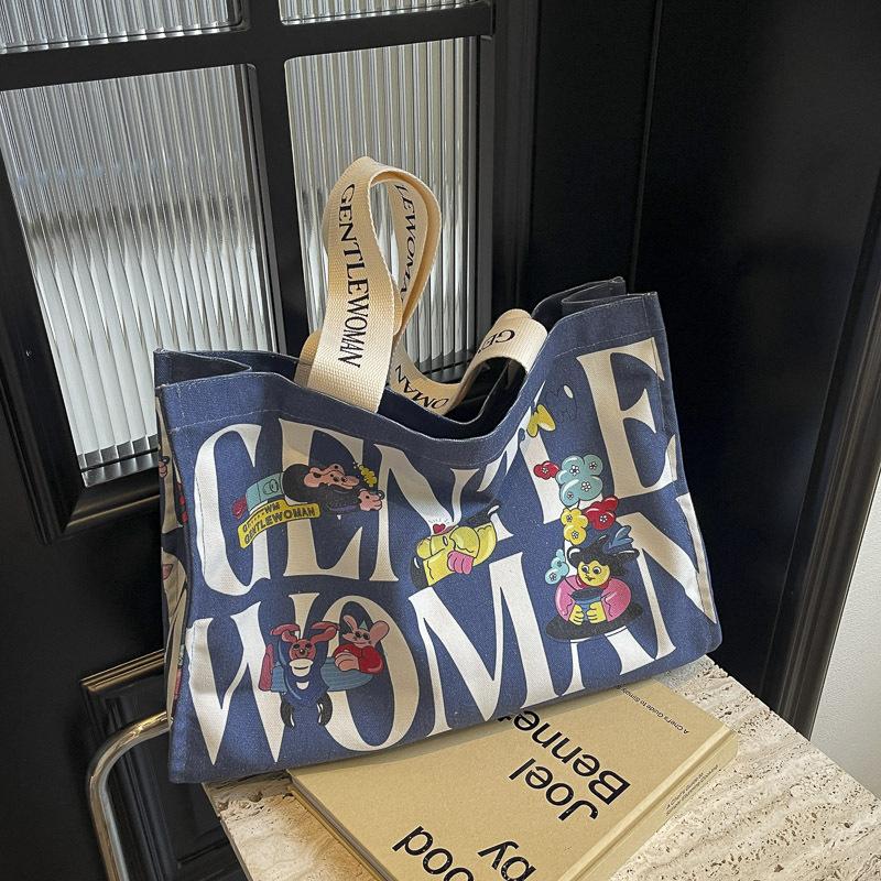 Canvas bag women's large capacity 2025 new bag portable commuter bag casual fashion fresh bag single shoulder mommy bag