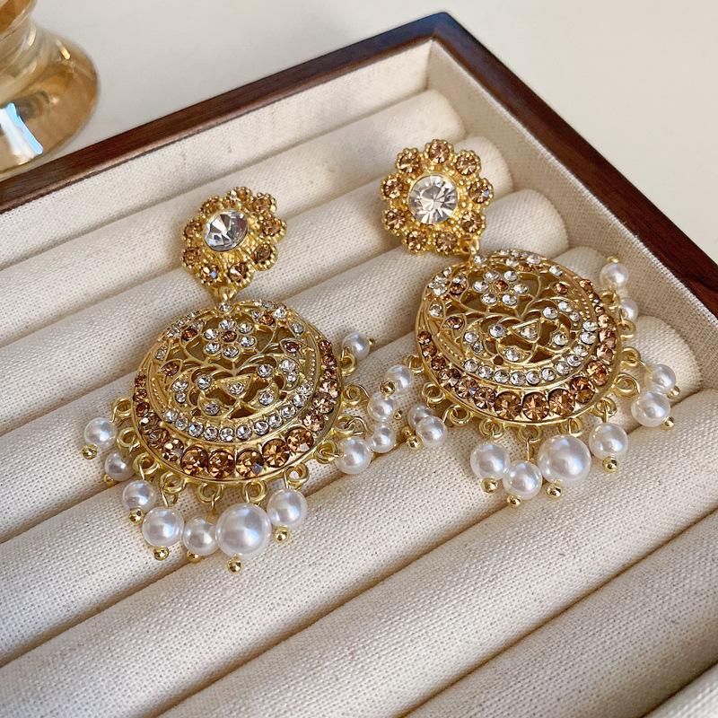 European and American metal wind hollow flower fishtail pearl earrings exaggerated temperament earrings heavy industry earrings