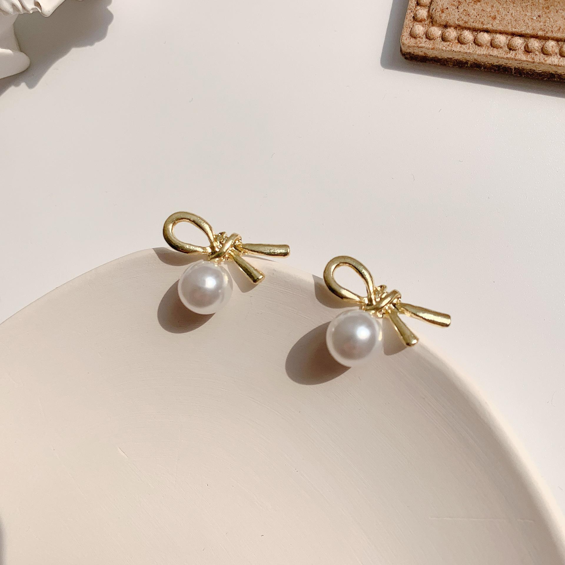 

Silver needle in wind pearl knotted earrings female cute sweet student versatile bow stud earrings female срібний