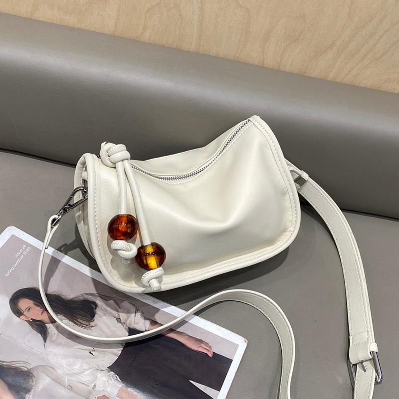 

Leather women s bag Boston bag first-layer cowhide shoulder bag, versatile messenger bag women s niche high-end pillow bag бежевый