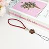 Creative Camellia Clover Lucky Phone Lanyard: Four-Leaf Clover Flower Woven PU Phone Chain Pendant.