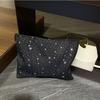 The new star polka dot clutch bag has a large capacity to go out and is versatile. Portable clutch wash bag, cosmetic storage bag.