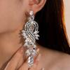 Lange Ohrringe mit Fransen, verziert mit funkelnden Zirkonanhängern. Ideal für Partys, Treffen, Weihnachten. Geeignet als Hochzeitsgeschenk.