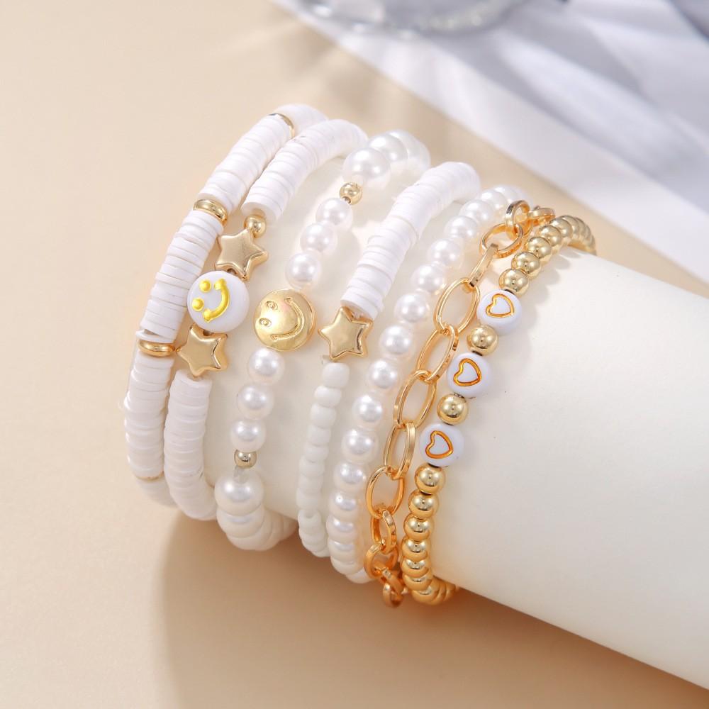 Korean version of fashion new multi-layer elastic thread soft pottery love smiley face bracelet set retro handmade pearl jewelry women