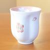 A perfect retirement gift for A pink teacup shaped like a cherry blossom Made in Made in Arita blossom Comes in a wooden women. petal. Japan. ware.