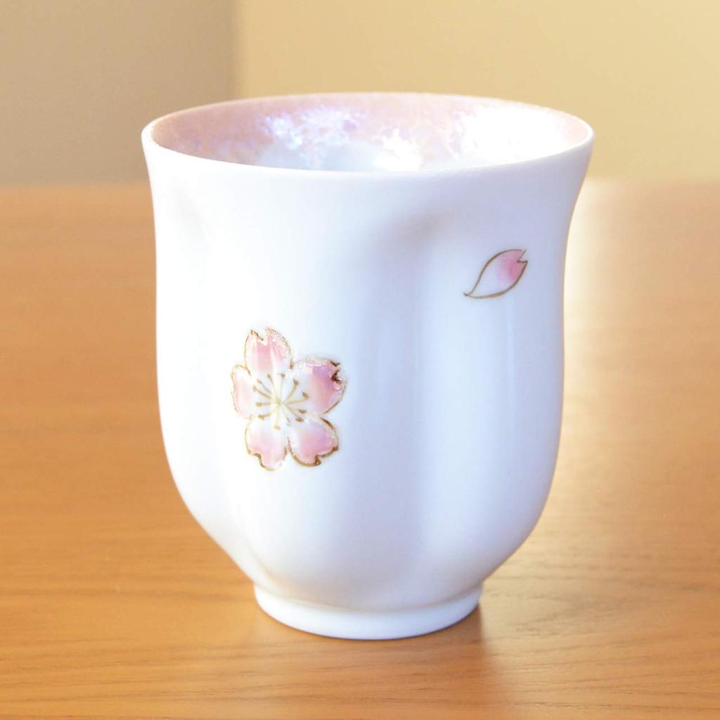 A perfect retirement gift for A pink teacup shaped like a cherry blossom Made in Made in Arita blossom Comes in a wooden women. petal. Japan. ware.