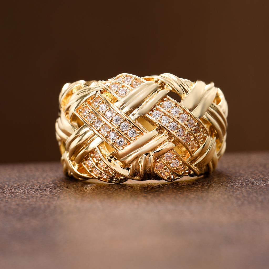 Retro woven and set with artificial gemstones ring made of copper. Women's jewelry ring suitable for formal events.