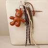 Leather Brown Bear Keychain With Articulated Limbs And Geometric Design For Fashion Accessories