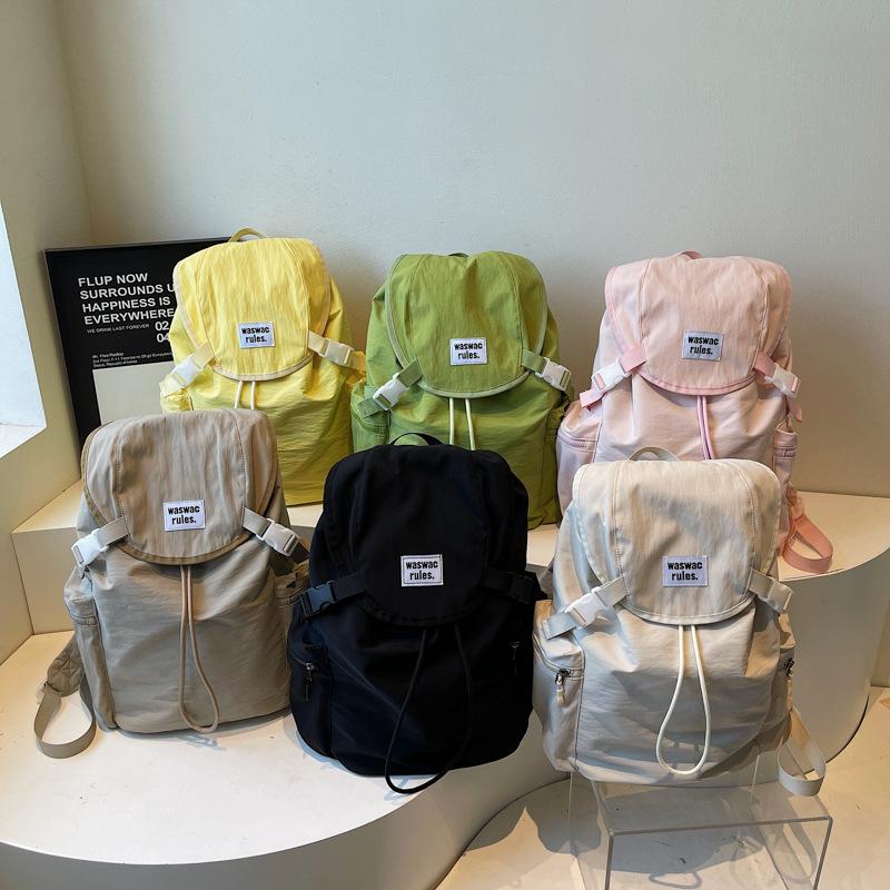 Schoolbag1011 new Korean niche lightweight nylon canvas backpack casual fashion drawstring travel large capacity backpack