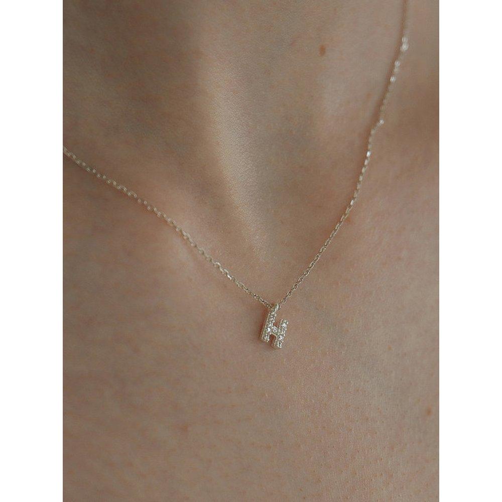 

Срібний кубічний кулон з ініціалом U