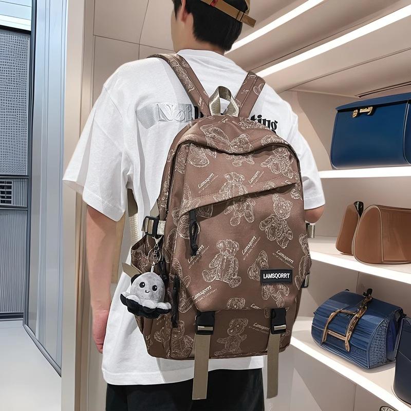 24 New cartoon printed large-capacity junior high school students' male and female school bags, fashionable casual backpacks