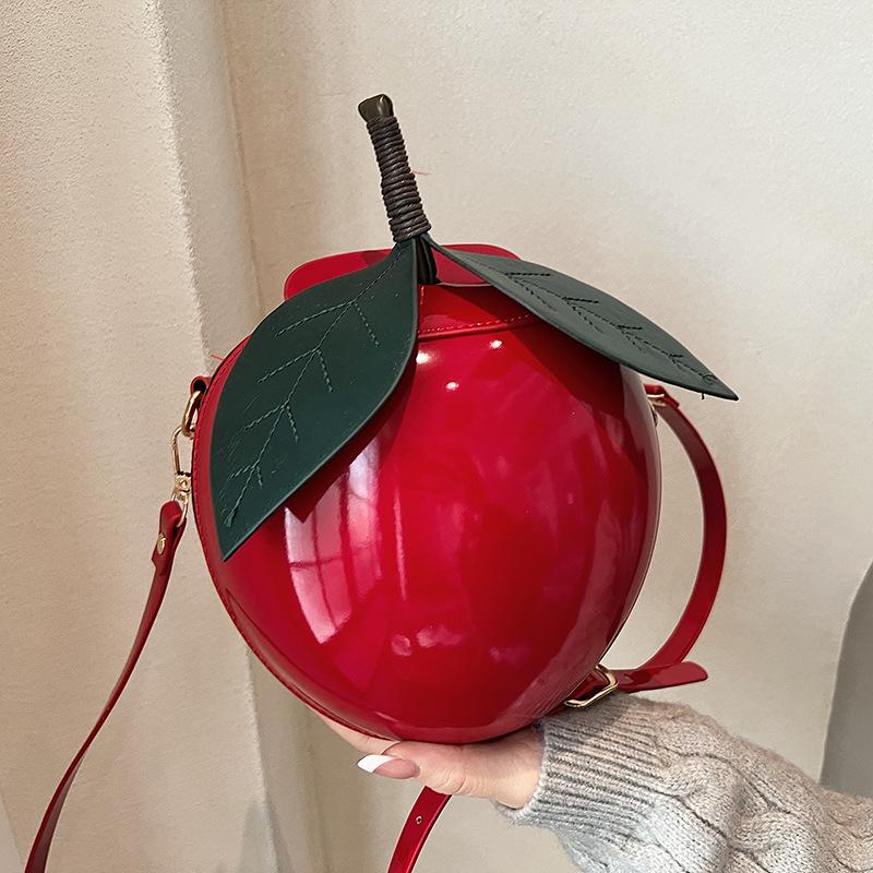 

Personality creative watermelon bag 2025 cute sweet girl fashion niche design foreign shoulder crossbody small round bag червоний