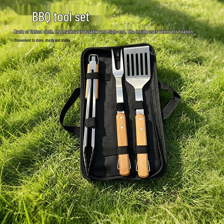 Premium Stainless Steel BBQ Tool Set with Wooden Handles - Includes Fork, Shovel, and Tongs for Outdoor Camping and Grilling.