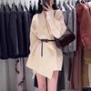 A New Women's Autumn and Winter Solid-color Mid-length Knitted Sweater Coat with A Cinched Waist and Elegant Style. It Can Be Paired with A Cardigan