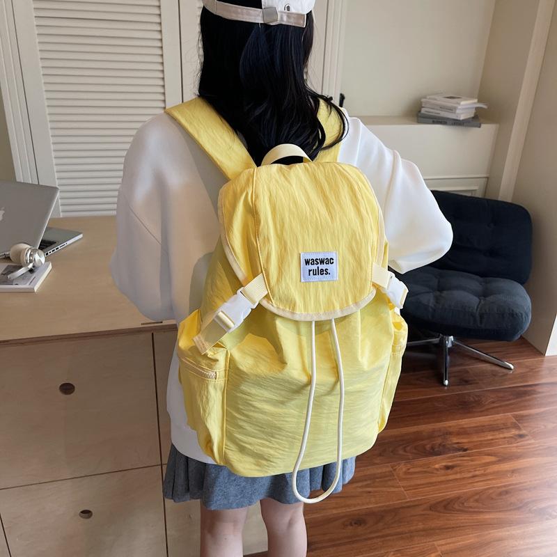 Schoolbag1011 new Korean niche lightweight nylon canvas backpack casual fashion drawstring travel large capacity backpack
