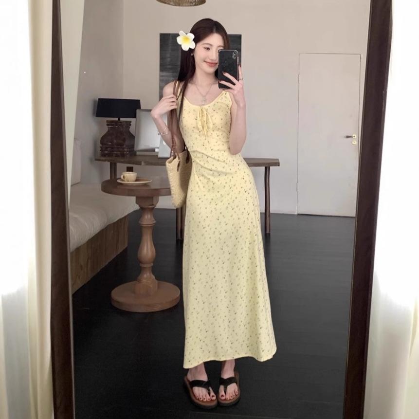 Yellow suspender dress women's summer new French waist design seaside vacation floral long skirt