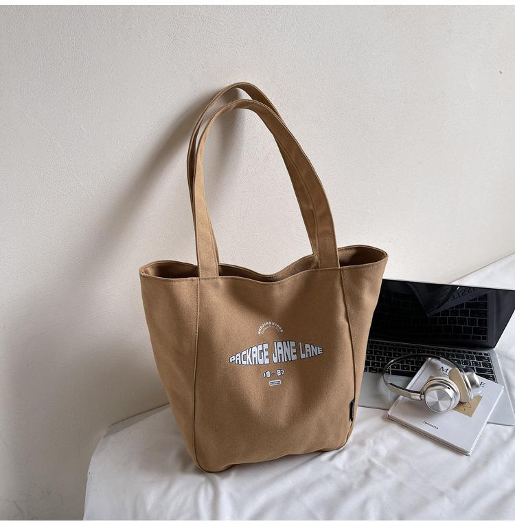 

Casual large-capacity canvas bag women s 2025 new student class tote bag fashionable and lightweight underarm shoulder bag
