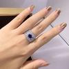 Huitan Funkelnde Damenringe mit ovalem blauem Zirkonia Breiter Ring Wunderschöne Hochzeitsaccessoires Farbe Silber Strahlender Modeschmuck