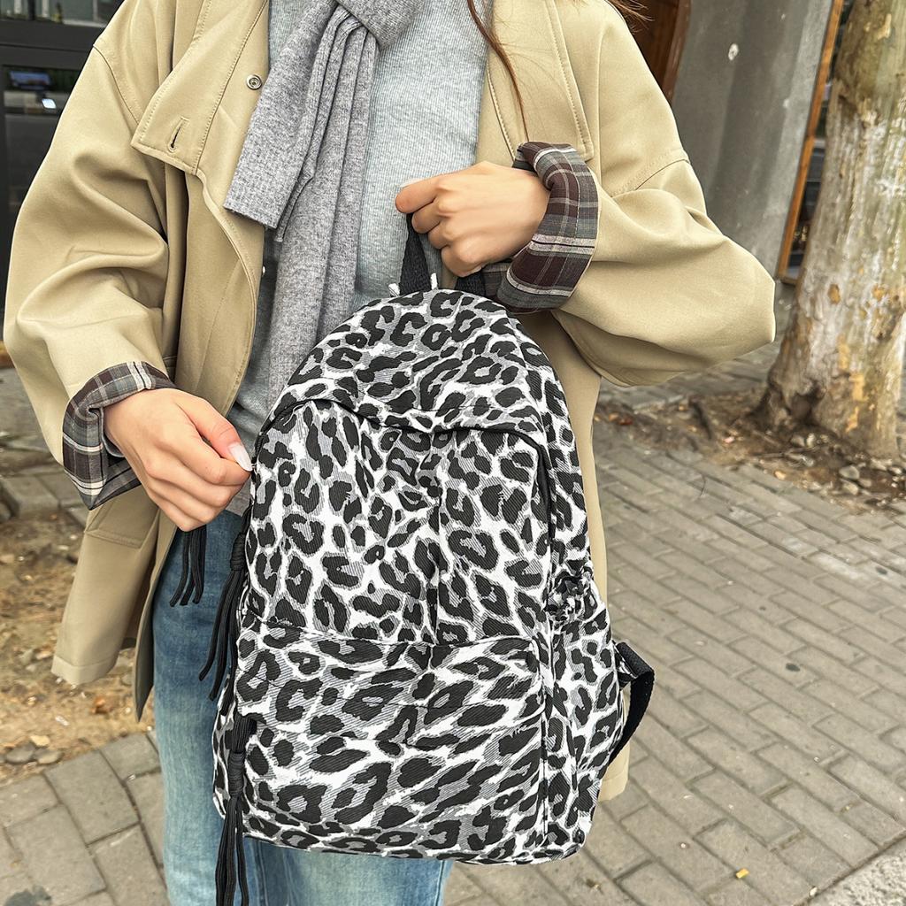 Leopard Print Backpack Casual Daily Use Trendy Street Style Lightweight Backpack for Women with Tassel Detail for School Travel and Everyday Outings