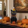 Halloween Cat Figurine Sitting with Pumpkin and Candy Corn Hat Decorative Resin Statue for Seasonal Tabletop Display and Home Decor