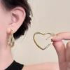 Boucles d'oreilles chics en forme de cœur pour femme: Design unique, tendance et audacieux
