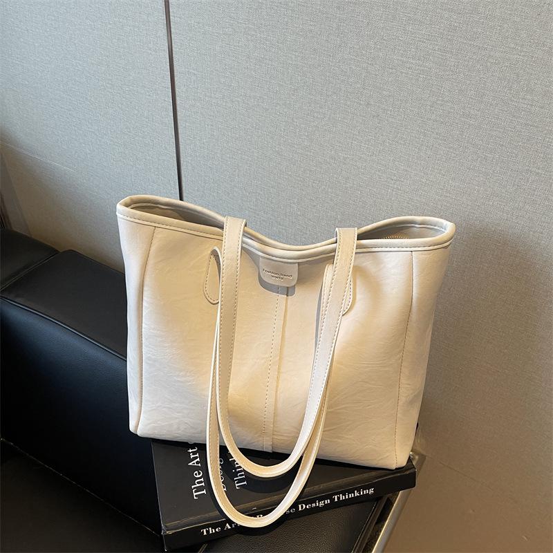 

Trendy Women s Cross-Border Large Capacity Shoulder Tote Bag – Versatile Niche Design for Commuters слоновая кость