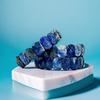 A Handcrafted Luxury Lapis Lazuli Bracelet with Fine Gold Veining; the Birthstone for September, Symbolizing Protection and Good Fortune.