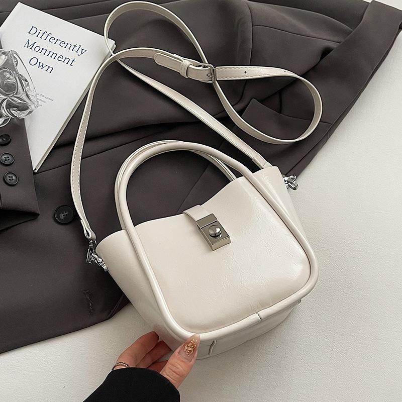 Spring and Summer New Casual Simple High-end Oil Wax Leather Portable Bucket Bag Korean Version Niche Design Solid Color Messenger Bag