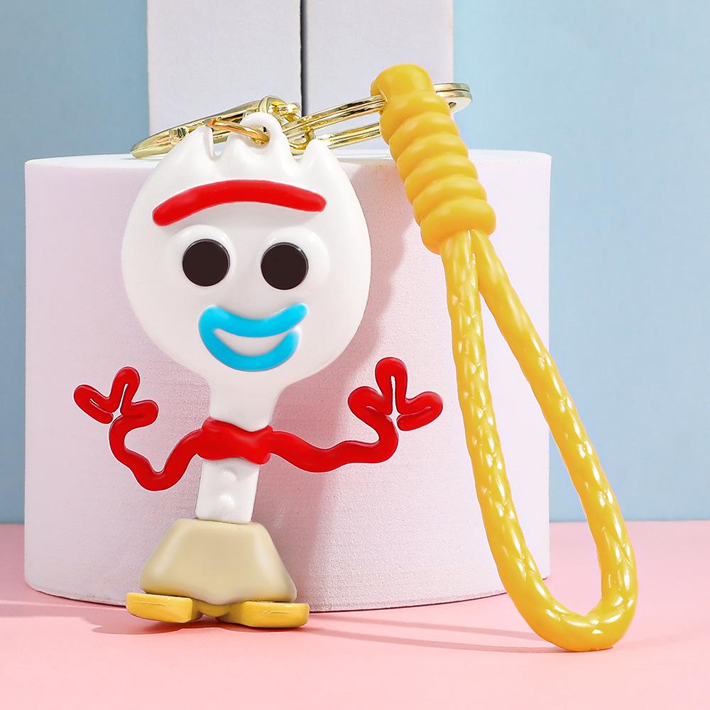 Best-Selling Toy Story Figures Keychain: Three-Eyed Alien, Buzz Lightyear, and Strawberry Bear Charms