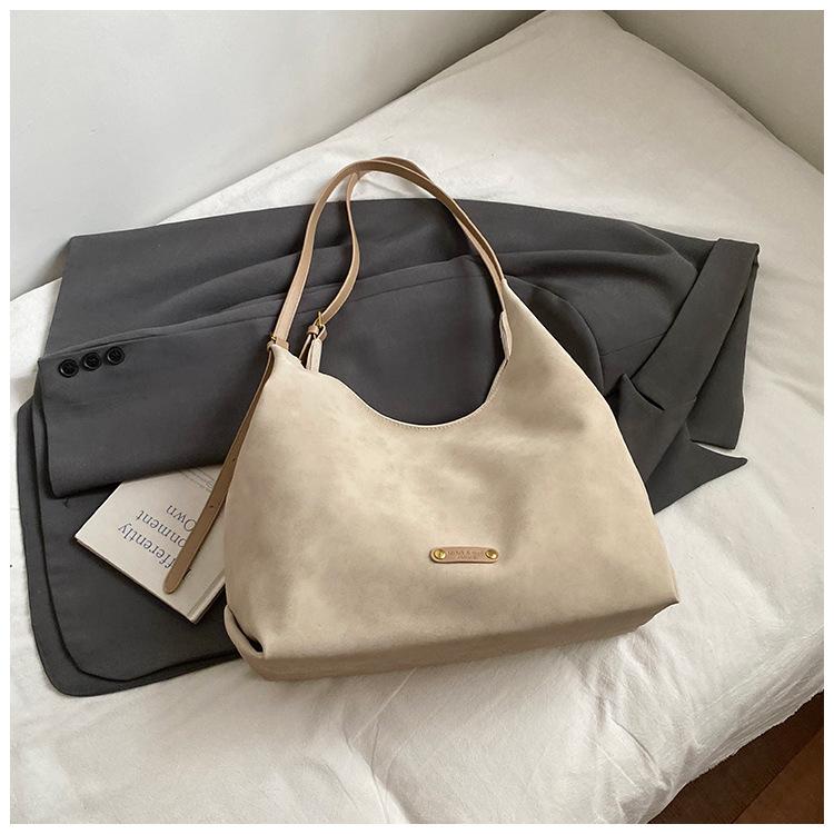 

Large-capacity tote water bag women s 2025 new fashion versatile niche commuter shoulder bag underarm bag