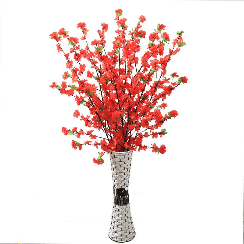 Manufacturers supply artificial peach blossom branches plum blossom branches fake peach blossom branches wedding decoration living room plastic flowe