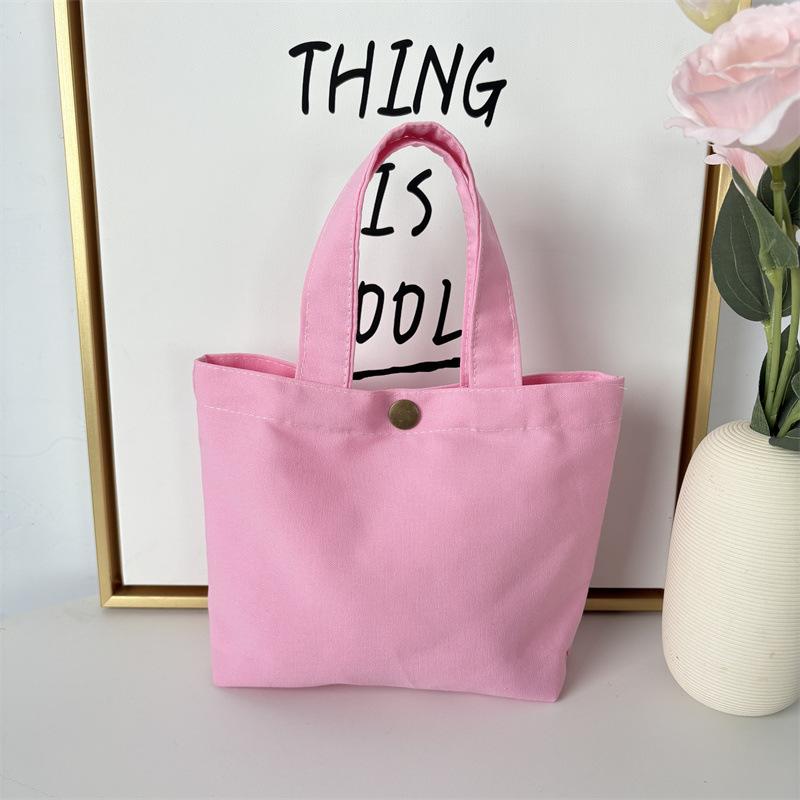 Effenkleurige eenvoudige lunchtas, draagbare canvas tas, kleine stoffen tas, draagbare canvas tas voor het opbergen van diverse spullen