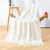 Orange knitted throw blanket for model homes, suitable for use as a sofa or bed throw, for furniture stores and home showrooms as a soft decoration