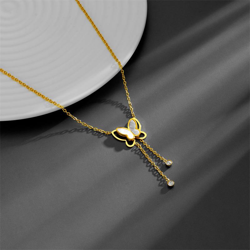 Stylish Titanium Steel Women's Necklace: Double-Layer White Shell with Rhinestone Butterfly Tassel, Hollow Design Collarbone Chain.