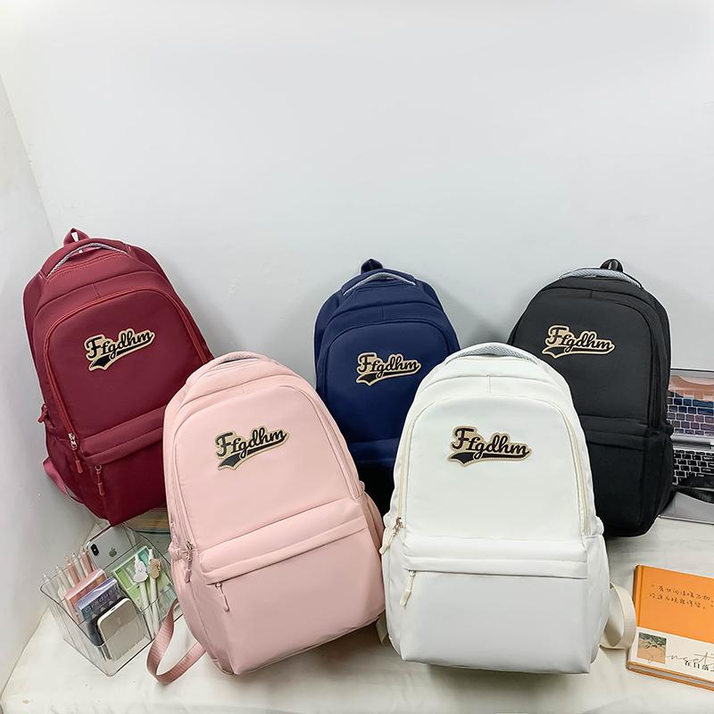 Weiblicher Rucksack mit großer Kapazität, einfarbig, Brief, Schüler, Schulranzen, männlicher Outdoor-Rucksack