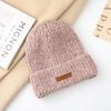 Autumn and winter pullover warm wool hat women's fashion leather label knitted confinement hat outdoor cycling sports hat