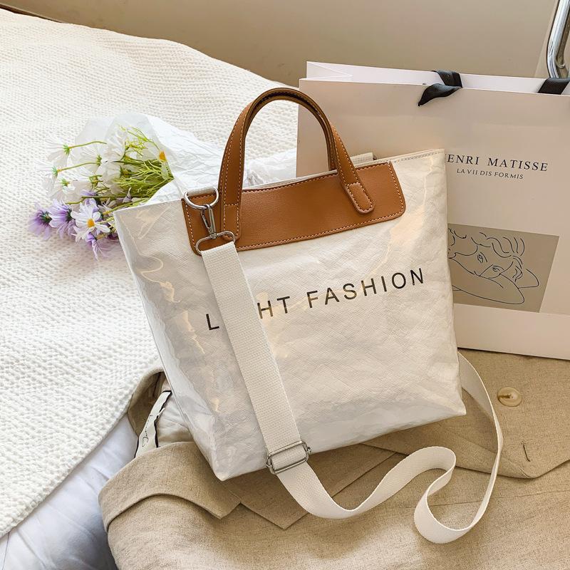 

Модная бумажная ПВХ сумка-желе женская 2025 лето новая прозрачная большой вместимости портативная для поездок на работу на плечо тоут Small (25 * 12 * 25)