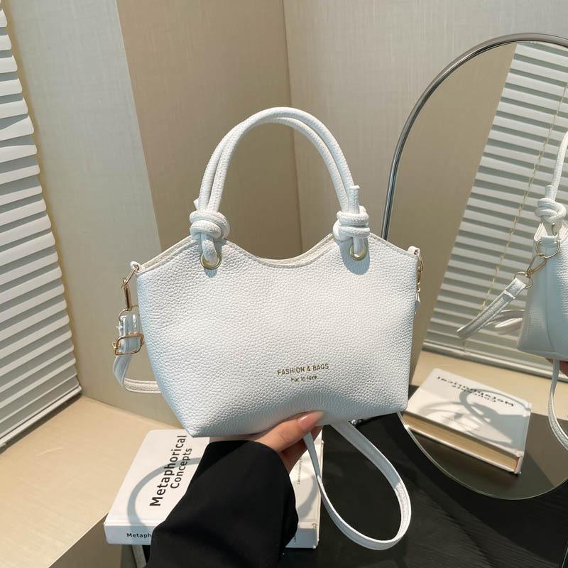 

Модная сумка-ведро для ручной носки, женская корейская версия, сумка на плечо в стиле инс, весна 2025, новая, простая, повседневная, портативная сумка-мессенджер белый