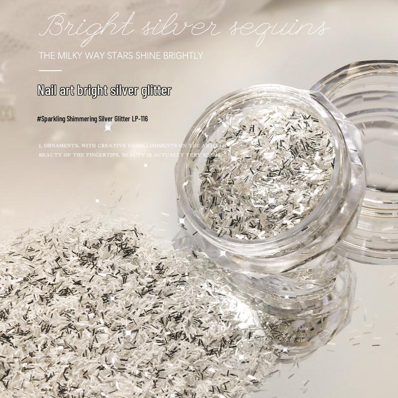 

Bright Silver Glitter Nail Art Accessories: Crushed Silver Foil, Holographic Glitter Sequins, and Stardust Flake Powder.