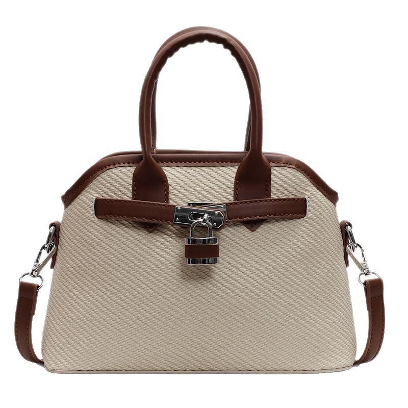 2025 new niche simple casual bucket bag women's one-shoulder crossbody bag cute retro hand-held shell bag