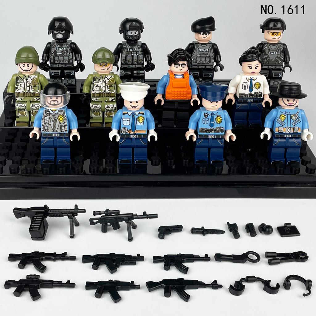 Schwarze Stadtpuppe 1611 Polizei-Figur Kinder Zusammengebaute Baustein-Spielzeuge Waffen-Zubehör Hongkong