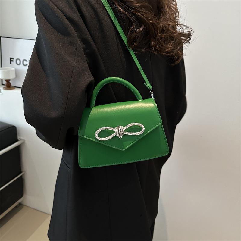 Simple and popular versatile solid color bow sewing line women's bag fashionable oblique span shoulder handbag
