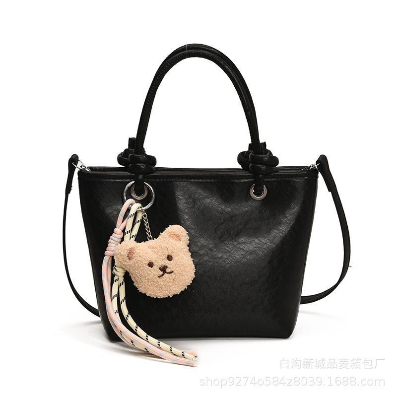 High-end hand-held bag women's 2025 new crossbody bucket bag winter trend texture versatile shoulder bag