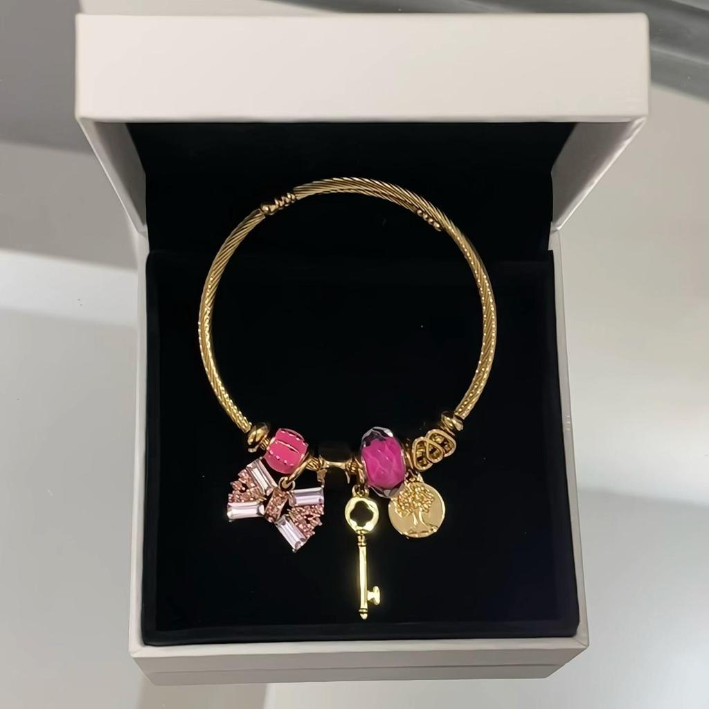 Panjia Fashion Gold Stainless Steel Bowknot Bracelet with Crystal Beads and Rhinestone Pendant.