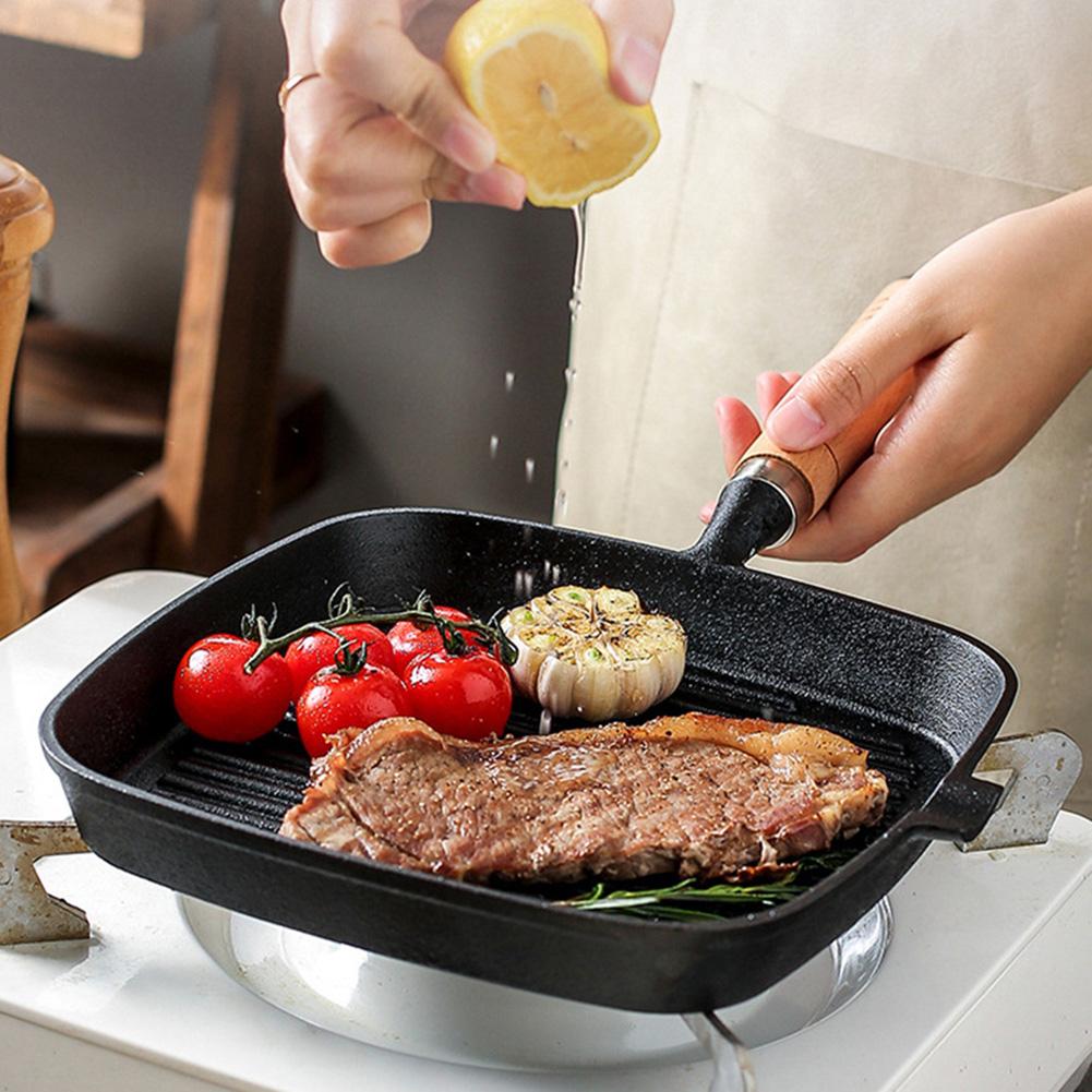 Parrilla de hierro fundido antiadherente de 9,25 pulgadas con mango de madera para cocinar en interiores y exteriores.