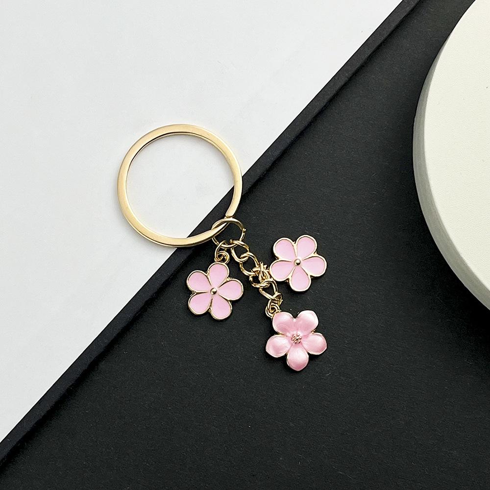 Sakura Oil Drop Keychain – Available in Black, White, Blue, Pink, Purple | Multiple Colors and Metal Parts | Luggage Accessory