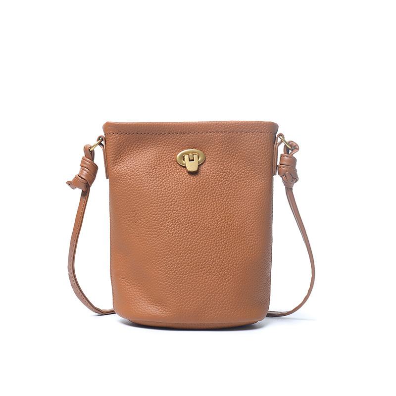 Miniaturowa torebka typu wiaderko z pierwszej warstwy skóry bydlęcej, torba na telefon komórkowy ze skóry naturalnej, prosta, swobodna torba listonoszka na ramię.