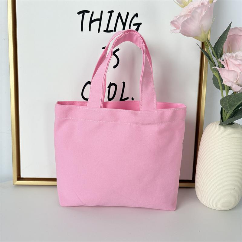 Effenkleurige eenvoudige lunchtas, draagbare canvas tas, kleine stoffen tas, draagbare canvas tas voor het opbergen van diverse spullen
