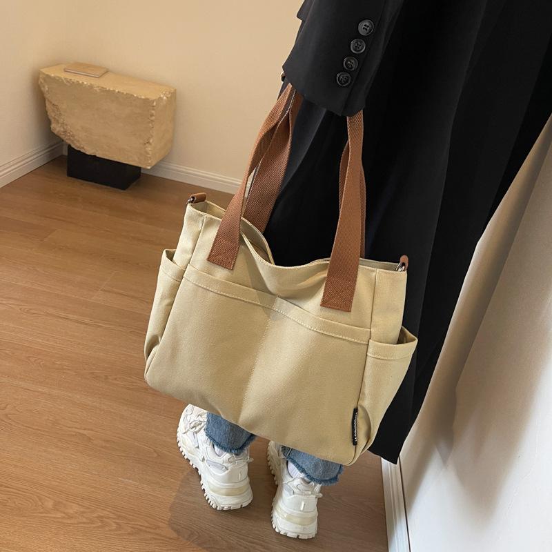 

Stylish and simple solid color canvas bag New college student shoulder messenger bag Women s casual versatile shoulder tote bag хакі