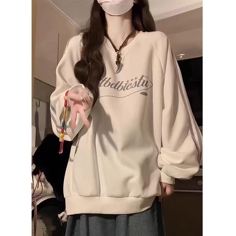 Bluza damska w paski z dekoltem w serek - Kolekcja Wiosna/Jesień 2024